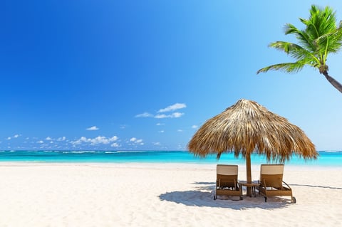Beautiful tropical beach with beach chairs in Caribbean